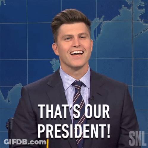 A Man In A Suit And Tie Says " That 'S Our President " While Holding A Pencil GIF