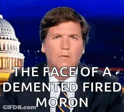 A Man In A Suit And Tie Says The Face Of A Demented Fired Moron In Front Of The Capitol Building GIF