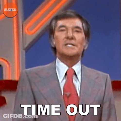 A Man In A Suit And Tie Says Time Out In Front Of A Buzzr Logo GIF
