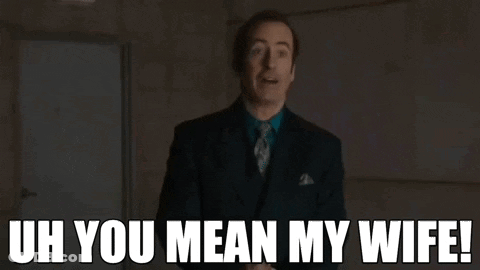 A Man In A Suit And Tie Says Uh You Mean My Wife . GIF