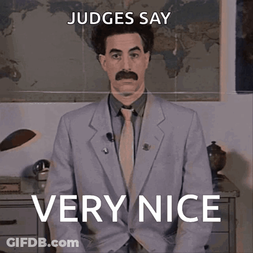 A Man In A Suit And Tie Says Very Nice GIF