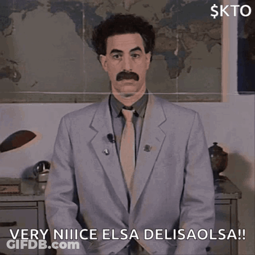 A Man In A Suit And Tie Says Very Nice Elsa Delisaolsa GIF