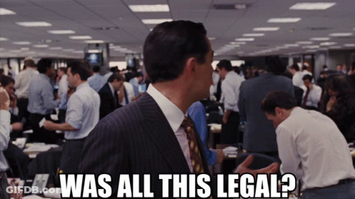 A Man In A Suit And Tie Says Was All This Legal In Front Of A Crowd Of People GIF