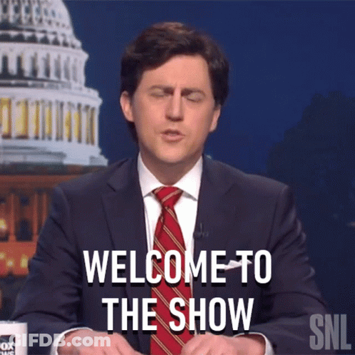 A Man In A Suit And Tie Says Welcome To The Show On Snl GIF