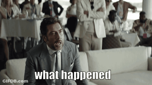A Man In A Suit And Tie Says " What Happened " In Front Of A Crowd GIF