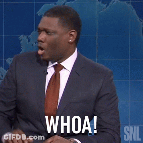 A Man In A Suit And Tie Says " Whoa " GIF
