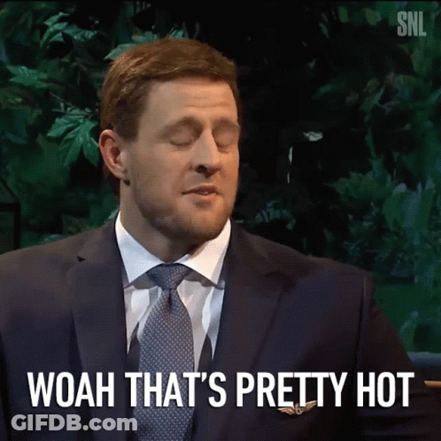 A Man In A Suit And Tie Says Woah That Is Pretty Hot GIF