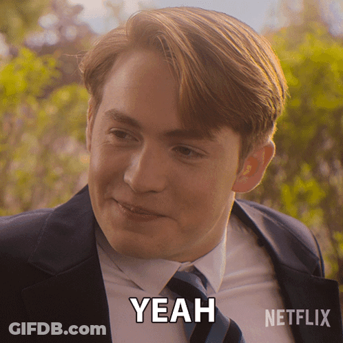 A Man In A Suit And Tie Says Yeah In A Netflix Advertisement GIF