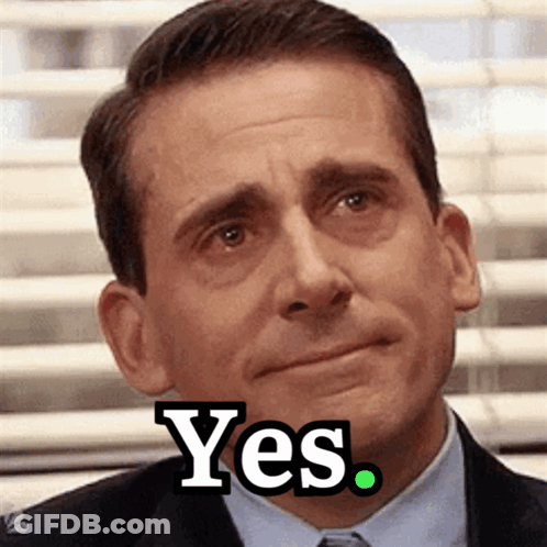 A Man In A Suit And Tie Says Yes On His Face GIF