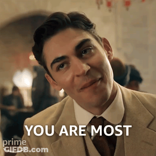 A Man In A Suit And Tie Says " You Are Most " In Front Of Him GIF