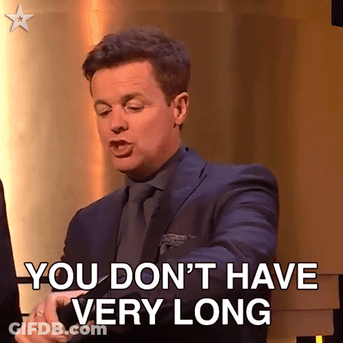 A Man In A Suit And Tie Says You Don T Have Very Long GIF