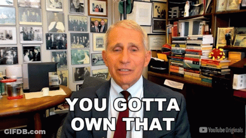 A Man In A Suit And Tie Says You Gotta Own That In Front Of A Wall Of Pictures GIF
