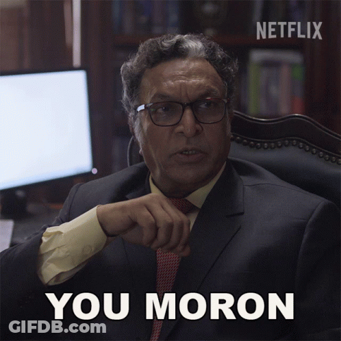 A Man In A Suit And Tie Says You Moron In Front Of A Netflix Logo GIF