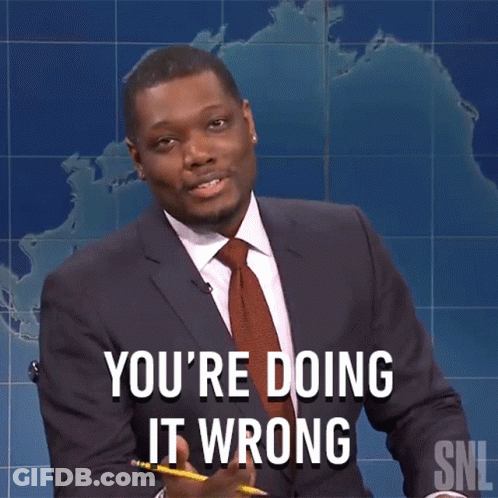 A Man In A Suit And Tie Says You 'Re Doing It Wrong While Holding A Pencil GIF