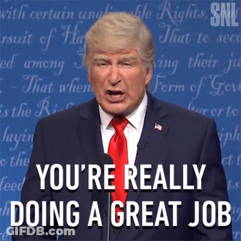 A Man In A Suit And Tie Says " You 'Re Really Doing A Great Job " At A Podium GIF
