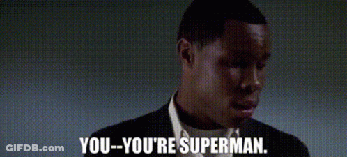A Man In A Suit And Tie Says You You 'Re Superman . GIF