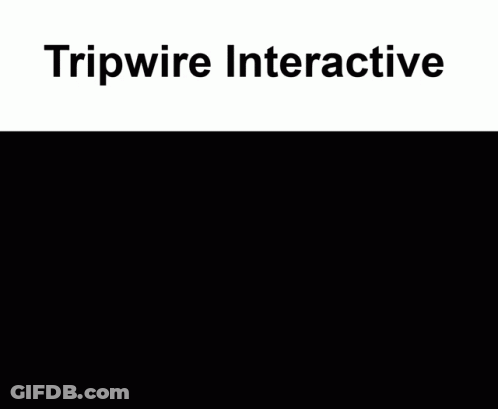 A Man In A Suit And Tie Shakes Hands With Another Man In A Hallway With Tripwire Interactive Written On The Top GIF