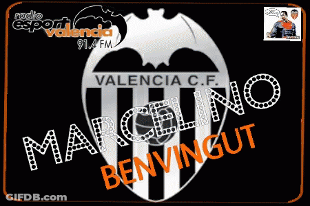 A Man In A Suit And Tie Sits In A Chair With The Name Marcelino Benvingut Written On It GIF
