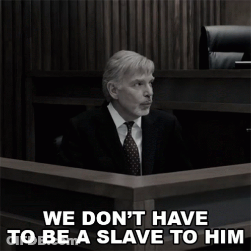 A Man In A Suit And Tie Sits In A Courtroom With The Words " We Don 'T Have To Be A Slave To Him " GIF