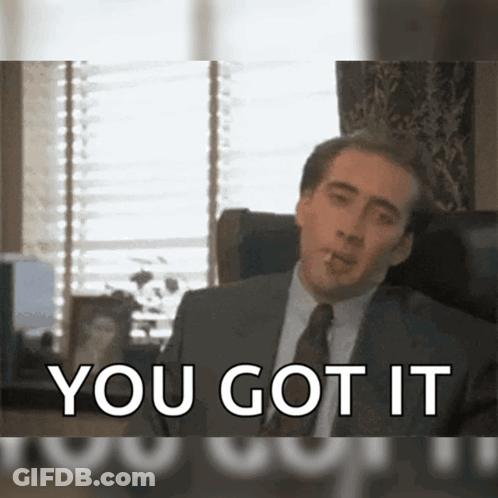 A Man In A Suit And Tie Smoking A Cigarette With The Words You Got It Behind Him GIF