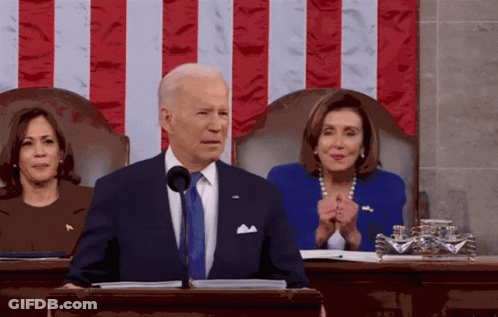 Man In Suit At Podium GIF