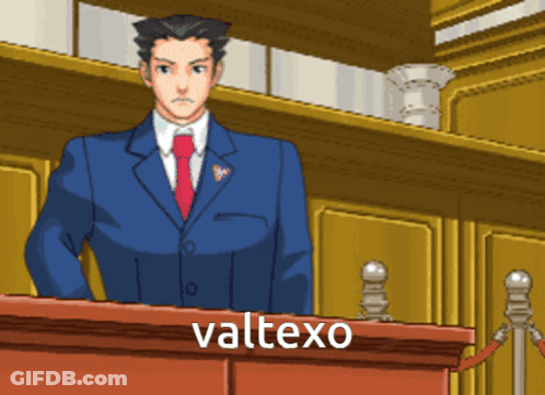 A Man In A Suit And Tie Stands At A Podium With The Word Valtexo Written Below Him GIF