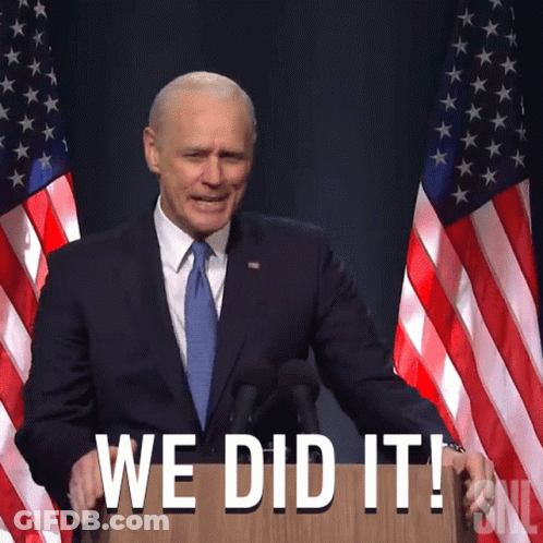 Man In Suit And Tie At Podium Saying We Did It GIF