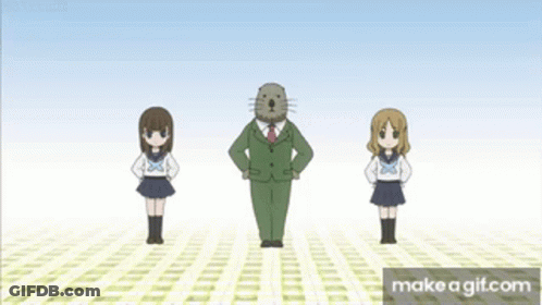A Man In A Suit And Tie Stands Between Two Girls In School Uniforms . GIF