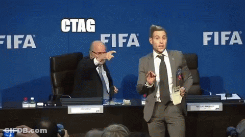 A Man In A Suit And Tie Stands In Front Of A Blue Wall That Says Fifa GIF