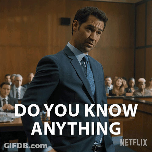 A Man In A Suit And Tie Stands In Front Of A Courtroom And Says " Do You Know Anything " GIF