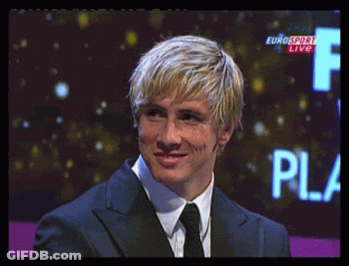A Man In A Suit And Tie Stands In Front Of A Eurosport Live Sign GIF