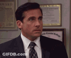 A Man In A Suit And Tie Stands In Front Of A Framed Certificate That Says ' Award ' On It GIF