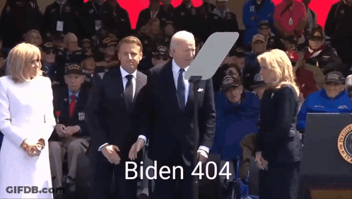 Man In Suit And Tie At Microphone Biden 404 GIF