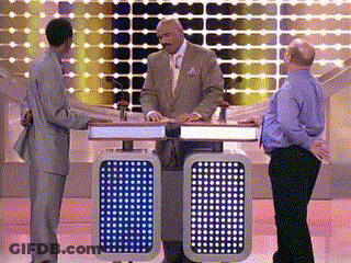 A Man In A Suit And Tie Stands In Front Of A Podium With A Blue Light On It That Says 00 GIF