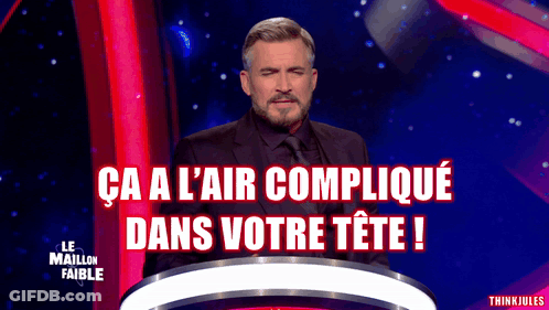 A Man In A Suit And Tie Stands In Front Of A Podium With The Words Ca A L' Air Complique Dans Votre Tete GIF