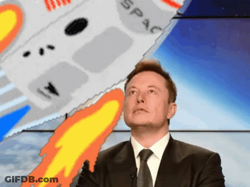 A Man In A Suit And Tie Stands In Front Of A Rocket That Says Space On It GIF