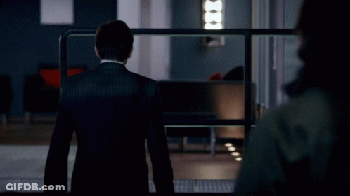 A Man In A Suit And Tie Stands In Front Of A Sign That Says Do N't Push Your Luck GIF