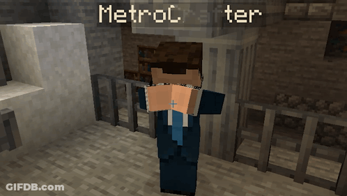 A Man In A Suit And Tie Stands In Front Of A Sign That Says Metroc After GIF
