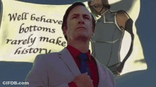 A Man In A Suit And Tie Stands In Front Of A Sign That Says " Well Behaved Bottoms Rarely Make History " GIF