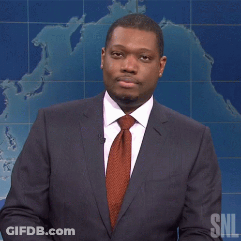 A Man In A Suit And Tie Stands In Front Of A Snl Map GIF