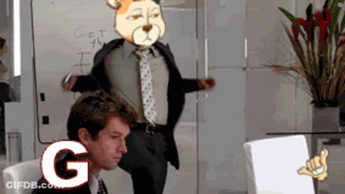 A Man In A Suit And Tie Stands In Front Of A White Board That Says Get The I On It GIF