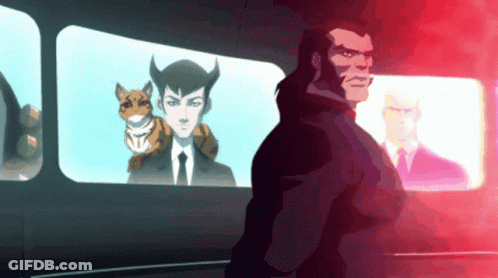 A Man In A Suit And Tie Stands In Front Of A Window With A Cat On His Shoulder GIF