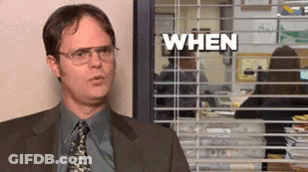 A Man In A Suit And Tie Stands In Front Of A Window With Blinds That Says " When " GIF
