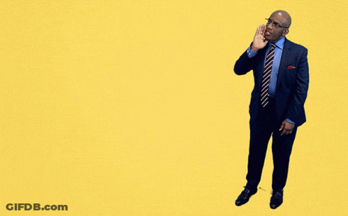 A Man In A Suit And Tie Stands In Front Of A Yellow Sign That Says Sunday Sunday Sunday GIF