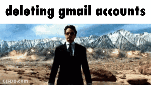 A Man In A Suit And Tie Stands In Front Of Mountains With The Words " Deleting Gmail Accounts " Above Him GIF