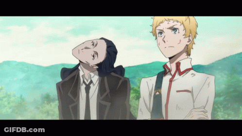 A Man In A Suit And Tie Stands Next To A Man In A White Shirt GIF