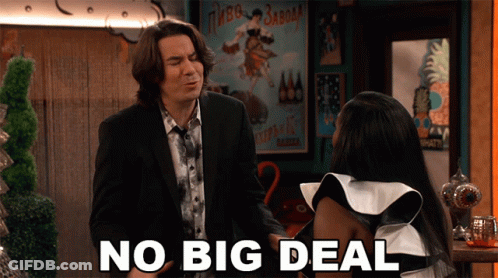 A Man In A Suit And Tie Stands Next To A Woman In A White And Black Dress And Says No Big Deal GIF