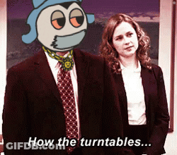 A Man In A Suit And Tie Stands Next To A Woman With The Words How The Turntables Written Below Him GIF