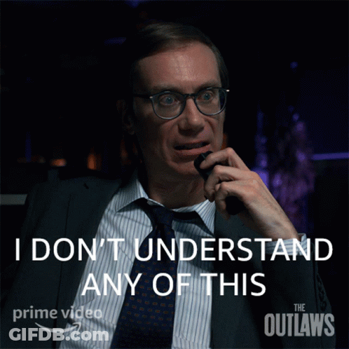 A Man In A Suit And Tie Talking On A Phone With The Words " I Don 'T Understand Any Of This " Behind Him GIF