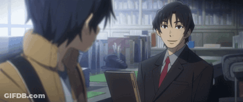A Man In A Suit And Tie Talking To Another Man In A Library GIF
